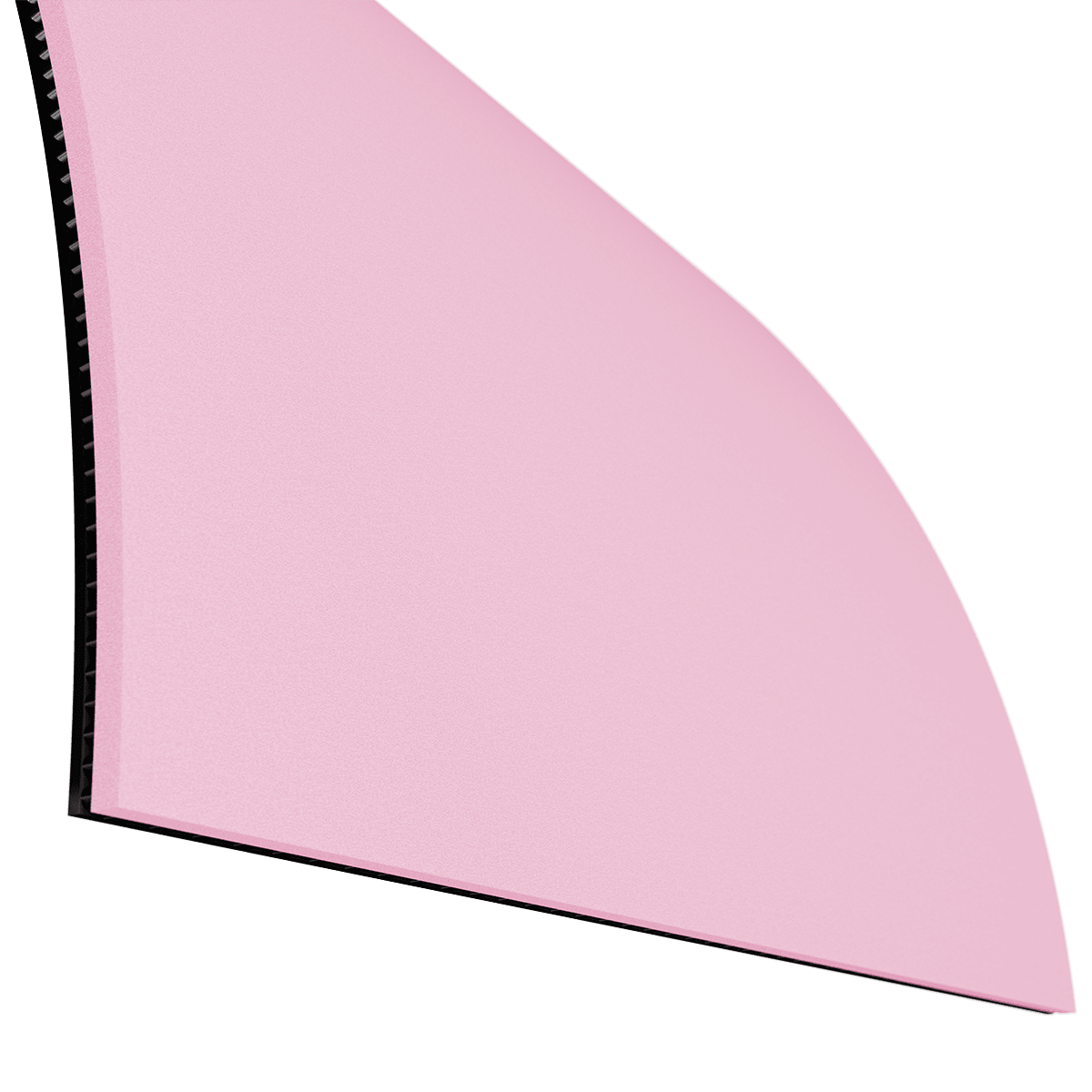 Ecke einer pinken, flexiblen Schneidematte mit schwarzer Unterseite.